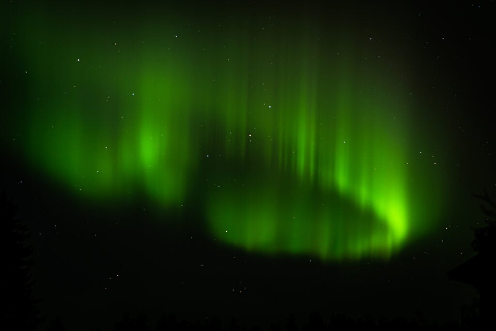 Northern lights with campfire