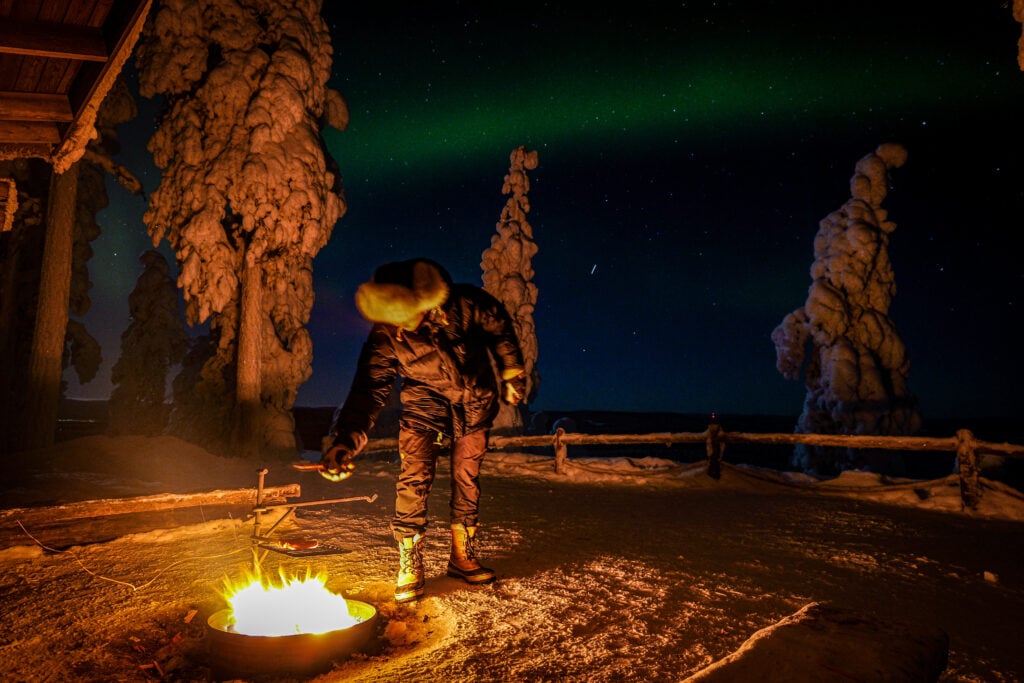 Northern lights with campfire