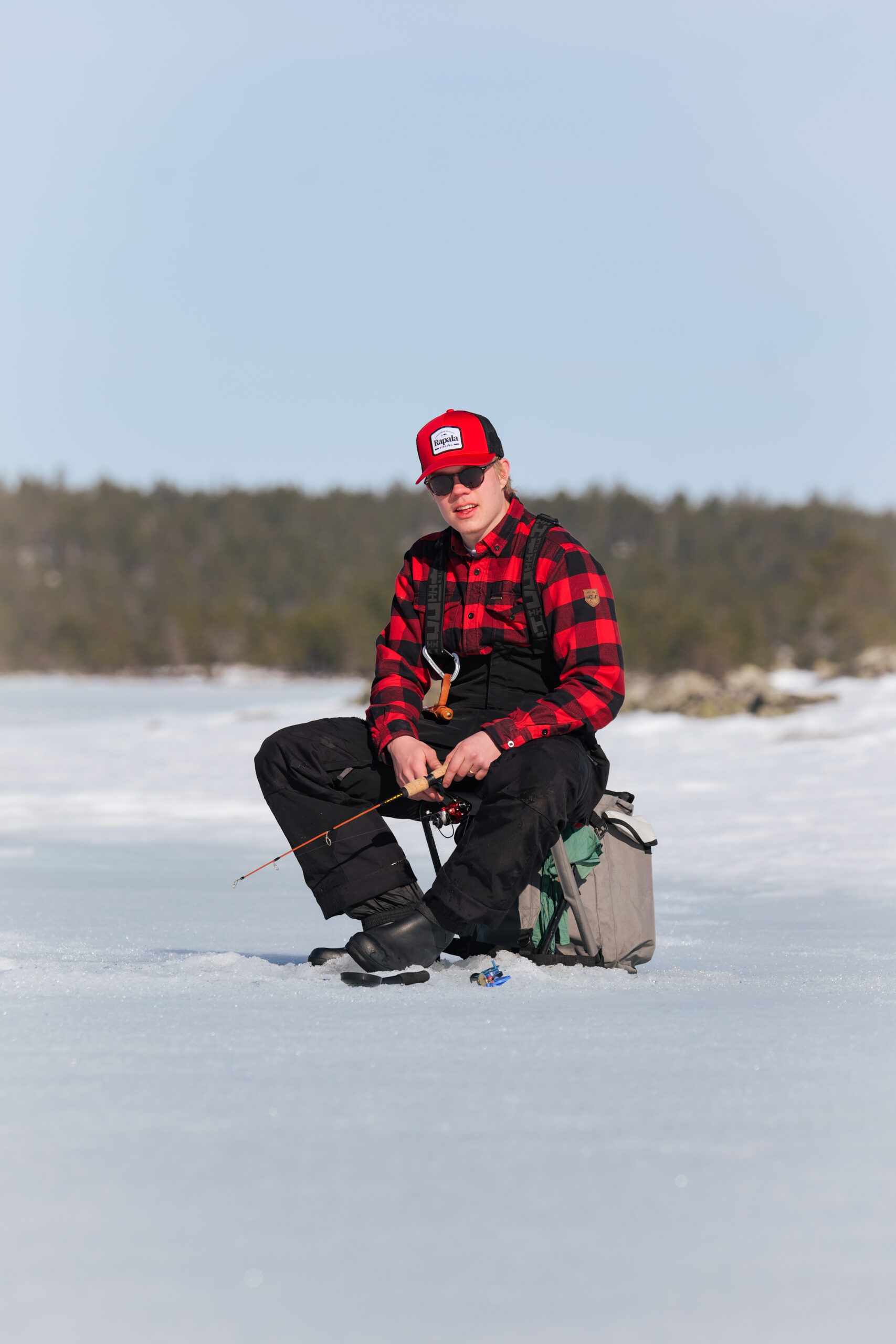 Icefishing thick ice wilderness with family Rovaniemi